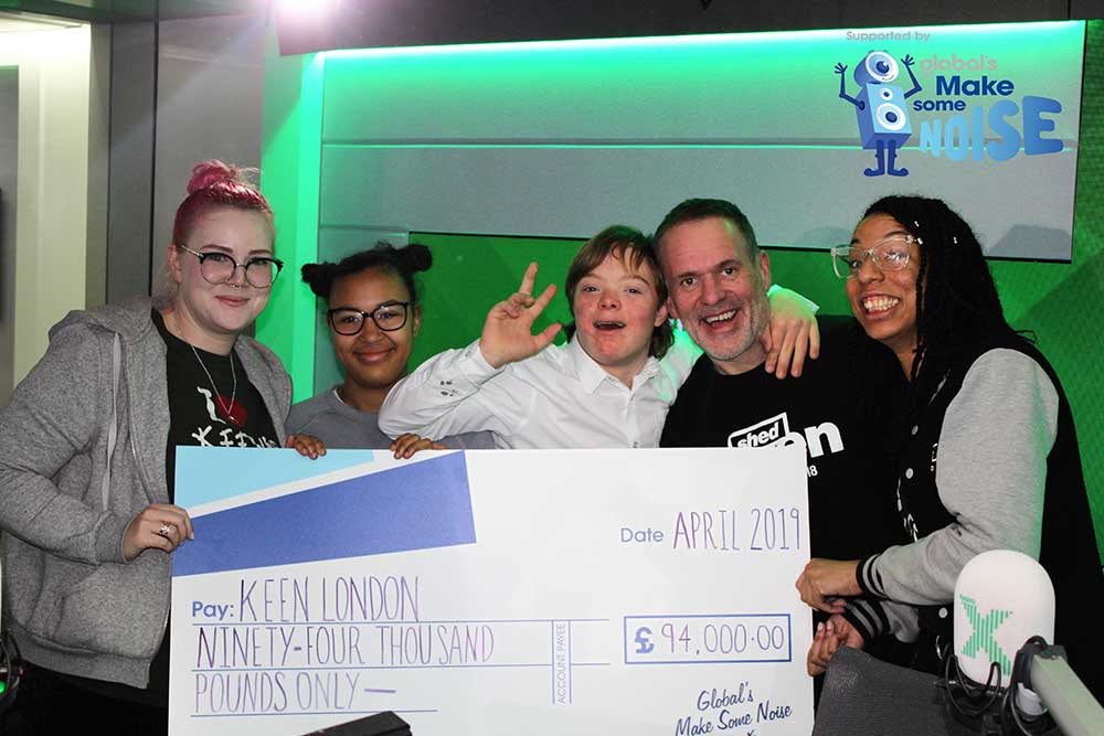 KEEN London receive a cheque for £94,000 from Global's Make Some Noise